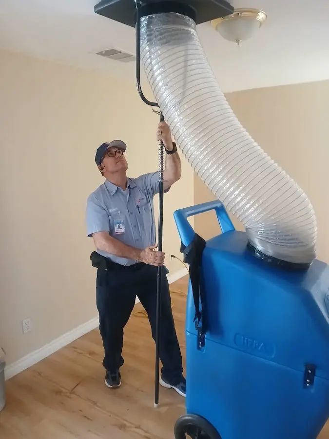 Furnace Tune-Up technician using HEPA equipment in Gardnerville